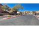 Community entrance with gated access, landscaping, and well-maintained surroundings at 1055 Admiral Emblem St, Henderson, NV 89015