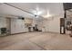 Spacious garage featuring a built-in workstation, storage cabinets, and epoxy flooring at 1055 Admiral Emblem St, Henderson, NV 89015