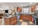 Well-equipped kitchen with dark countertops, stainless steel appliances, and ample cabinetry for storage and meal preparation at 1055 Admiral Emblem St, Henderson, NV 89015