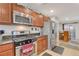 Functional kitchen with gas range, stainless steel refrigerator, and stylish cabinetry offers a practical cooking space at 1055 Admiral Emblem St, Henderson, NV 89015