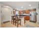 Charming kitchen with dark wood cabinets, stainless steel appliances, and tiled floor, perfect for culinary enthusiasts at 1055 Admiral Emblem St, Henderson, NV 89015