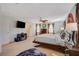 Carpeted main bedroom with many windows, fan, and tv at 1055 Admiral Emblem St, Henderson, NV 89015