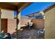 Enclosed outdoor patio with brick pavers and a grill at 1055 Admiral Emblem St, Henderson, NV 89015
