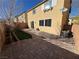 A backyard featuring a paver patio, minimal landscaping, and easy access to the home at 10715 York Manor Ave, Las Vegas, NV 89166