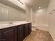 Bathroom with a shower-tub combo and vanity at 10715 York Manor Ave, Las Vegas, NV 89166
