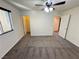 Bedroom with carpet, a ceiling fan and lights, and windows with blinds at 10715 York Manor Ave, Las Vegas, NV 89166