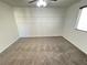 Bedroom with a ceiling fan, carpeted flooring, and decorative trim at 10715 York Manor Ave, Las Vegas, NV 89166