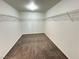 Walk-in closet with carpeted floor and overhead wire shelving at 10715 York Manor Ave, Las Vegas, NV 89166