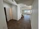 Entryway with tile flooring, neutral walls, staircase access and doors to other rooms at 10715 York Manor Ave, Las Vegas, NV 89166