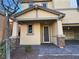 Charming front entrance with stone accents, paver walkway, and a well-manicured landscape at 10715 York Manor Ave, Las Vegas, NV 89166