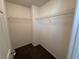 Empty walk-in closet providing ample space for storage with built in wire racks at 10715 York Manor Ave, Las Vegas, NV 89166