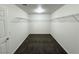 Spacious walk-in closet featuring ample shelving and neutral carpeting at 10715 York Manor Ave, Las Vegas, NV 89166