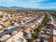 Aerial view of a neighborhood featuring single-story homes and desert landscaping at 10801 Clarion Ln, Las Vegas, NV 89134