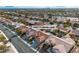 Aerial view of a home with a tile roof in a suburban neighborhood at 10801 Clarion Ln, Las Vegas, NV 89134