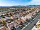 Wide aerial view of a neighborhood with a highway in the background at 10801 Clarion Ln, Las Vegas, NV 89134