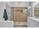 Modern bathroom featuring a walk-in shower, and white vanity with double sinks at 10801 Clarion Ln, Las Vegas, NV 89134