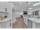 Modern kitchen featuring a large island with stainless steel appliances and quartz countertops at 10801 Clarion Ln, Las Vegas, NV 89134
