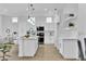 Bright kitchen featuring a center island, modern appliances, and pendant lighting at 10801 Clarion Ln, Las Vegas, NV 89134