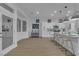 Bright open kitchen with a center island and bar stools, perfect for modern living at 10801 Clarion Ln, Las Vegas, NV 89134