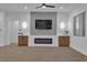 Modern living room features a decorative fireplace, stylish wall accents, and custom cabinetry at 10801 Clarion Ln, Las Vegas, NV 89134