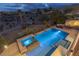 Aerial view of a luxurious pool and spa area with a beautiful landscape, perfect for relaxation at 11241 Golden Chestnut Pl, Las Vegas, NV 89135