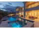 Elegant backyard featuring a pool, spa, and multiple seating areas, perfect for entertaining guests at 11241 Golden Chestnut Pl, Las Vegas, NV 89135