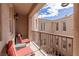 Balcony seating offering views of courtyard with water feature and desert architecture at 11241 Golden Chestnut Pl, Las Vegas, NV 89135