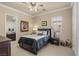 Serene bedroom with a queen-sized bed, neutral tones, and natural light from the window at 11241 Golden Chestnut Pl, Las Vegas, NV 89135