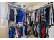 Well-organized walk-in closet with hanging racks, shelving, and efficient use of space at 11241 Golden Chestnut Pl, Las Vegas, NV 89135