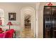 Hallway leading to stairway with archways and elegant decor at 11241 Golden Chestnut Pl, Las Vegas, NV 89135