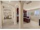 Open layout showcasing the office, with arched walkways and adjacent bedroom at 11241 Golden Chestnut Pl, Las Vegas, NV 89135