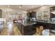 Kitchen featuring large island with granite countertops and dark cabinetry at 11241 Golden Chestnut Pl, Las Vegas, NV 89135