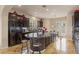 Spacious kitchen with large island, dark cabinets, and granite countertops at 11241 Golden Chestnut Pl, Las Vegas, NV 89135