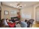 Inviting living room featuring comfortable seating, ceiling fan, and a media setup at 11241 Golden Chestnut Pl, Las Vegas, NV 89135