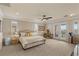 Bright and airy main bedroom features a ceiling fan and access to a private balcony at 11241 Golden Chestnut Pl, Las Vegas, NV 89135