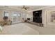 Relaxing main bedroom with a fireplace, balcony access, and custom built-in shelving at 11241 Golden Chestnut Pl, Las Vegas, NV 89135