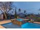 Tranquil pool and spa with a view of palm trees, offering a private and luxurious retreat at 11241 Golden Chestnut Pl, Las Vegas, NV 89135