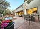 The backyard has a fire pit, a spa with waterfall, and an outdoor dining area under a covered patio at 11660 Intervale Rd, Las Vegas, NV 89135