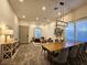 Dining room with a large table, stylish chairs, accent lighting, and lots of room for entertaining at 11660 Intervale Rd, Las Vegas, NV 89135