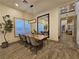 Dining room with a large table, stylish chairs, modern mirror, and lots of room for entertaining at 11660 Intervale Rd, Las Vegas, NV 89135