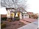 Inviting two-story home featuring a well-manicured front yard and an attached two-car garage at 11660 Intervale Rd, Las Vegas, NV 89135
