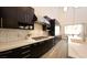Well-appointed kitchen features stainless steel appliances, marble countertops, and lots of cabinet space at 11660 Intervale Rd, Las Vegas, NV 89135