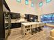 Modern kitchen with an island, stainless steel appliances, and a view of the backyard through large windows at 11660 Intervale Rd, Las Vegas, NV 89135