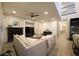 Bright, open living room with fireplace, ceiling fan and modern finishes offers plenty of room to relax at 11660 Intervale Rd, Las Vegas, NV 89135