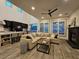 Bright and airy living room with high ceilings, a fireplace, and an adjacent kitchen area create a warm, inviting space at 11660 Intervale Rd, Las Vegas, NV 89135