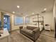 Spacious main bedroom featuring a seating area, large windows, and stylish furnishings at 11660 Intervale Rd, Las Vegas, NV 89135