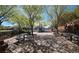 Neighborhood park featuring a playground with picnic tables, benches, and shade structures at 11660 Intervale Rd, Las Vegas, NV 89135