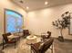 Relaxing sitting room with modern furnishings, neutral tones, and a large window for natural light at 11660 Intervale Rd, Las Vegas, NV 89135