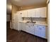 Modern kitchen with white cabinets, marble countertops, and stainless steel appliances at 1608 Joshua Tree Ct, Las Vegas, NV 89108