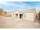 A rear exterior view of a home with a covered patio, a blank canvas backyard, and block wall at 187 Golden Crown Ave, Henderson, NV 89002